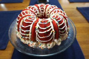 Cast Iron Fluted Cake Pan with Red Potholders