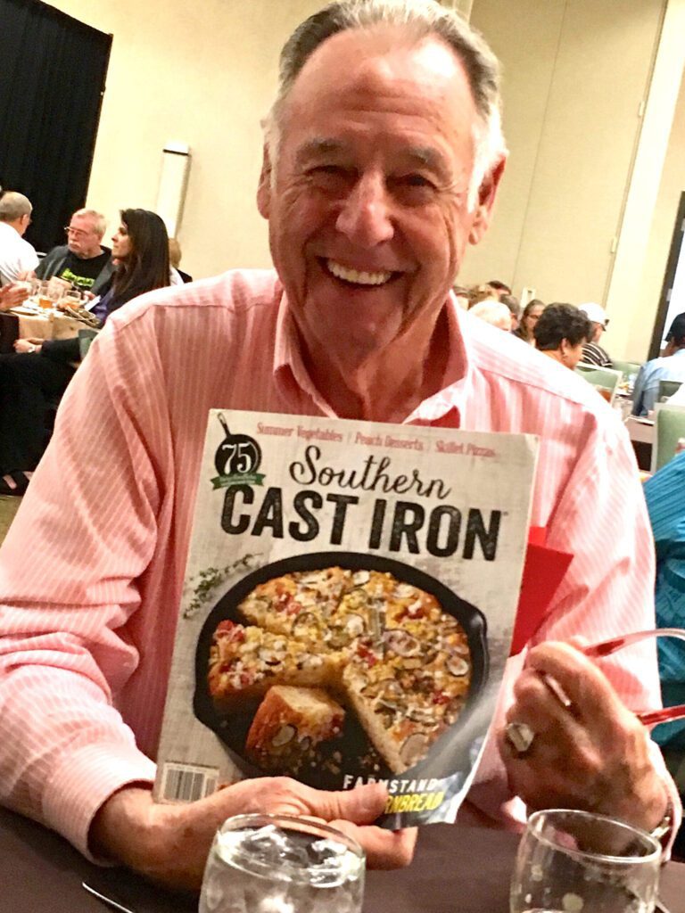 Harold Henry of Hamilton Missouri holding the magazine Southern Cast Iron that contained the article written about him.