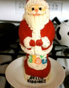 Griswold vintage cast iron Santa cake mold, frosted cake using antique pan