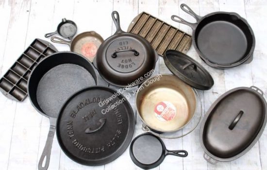 Some of John Clough's vintage and antique cast iron collection including Lodge Mfg. Co. French roll pan no. 28 smoky mountain advertising ashtray skillet with red label Dutch skillet and lid cover cob pan no. 28 oval roaster 4 with trivet hammered no. 2 skillet three legged camp oven chuckwagon Blacklock spider pan and lid. 
