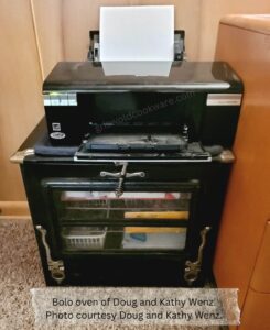 wenz bolo oven serving as a printer stand and cabinet.