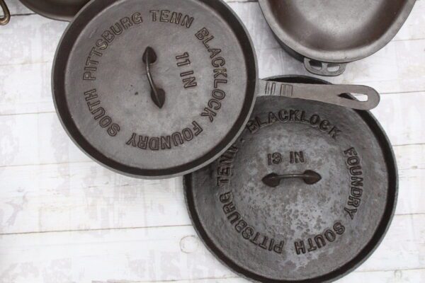 two antique blacklock lodge cast iron lid covers collection of John Clough