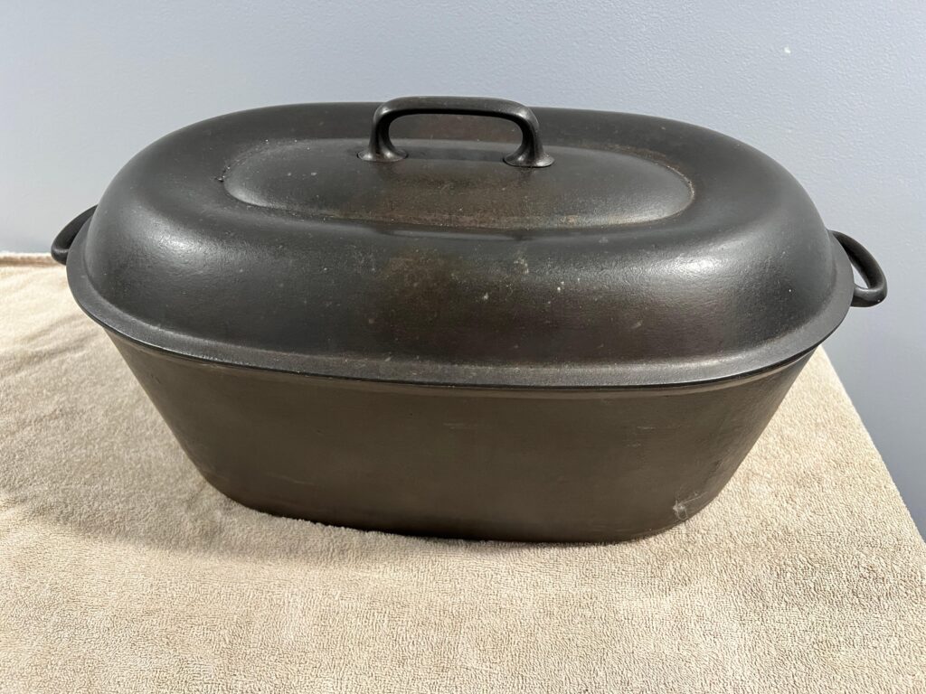 favorite piqua ware smile smiley logo oval roaster vintage antique auction cast iron price value sell sold for how much