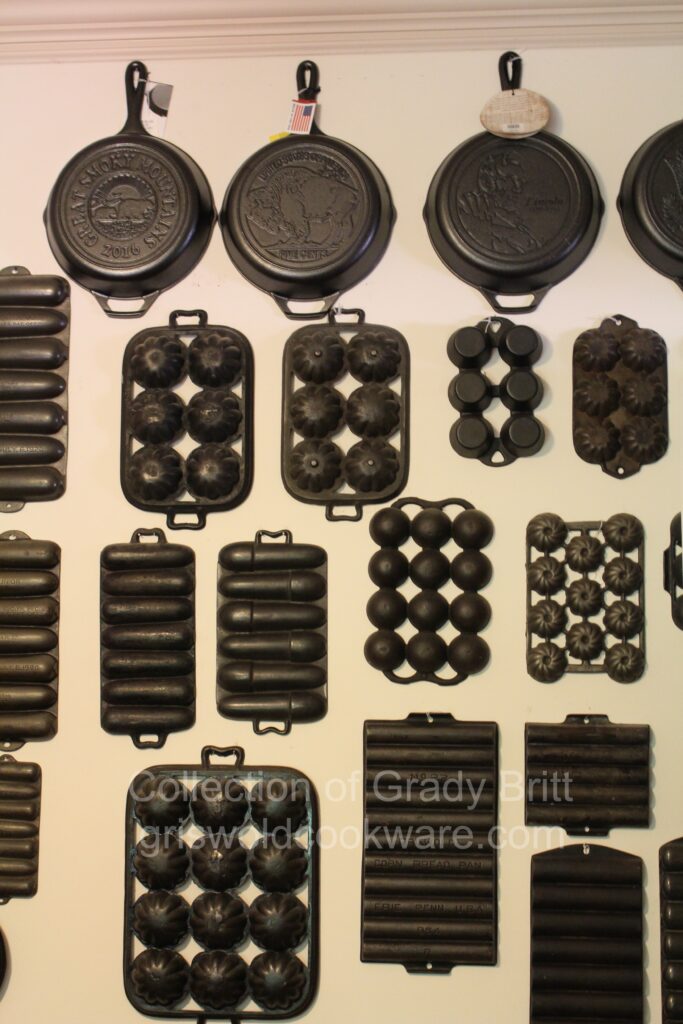 Some of Lodge Vintage Cast Iron collector Grady Britt's gem and muffin pans along with advertising skillets made by Lodge. 