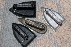 Grady Britt's collection of antique vintage Lodge Blacklock cast iron sad irons. 