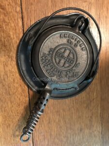 Collector Grady Britt's no. 0 Griswold vintage toy American cast iron waffle iron with low base. 