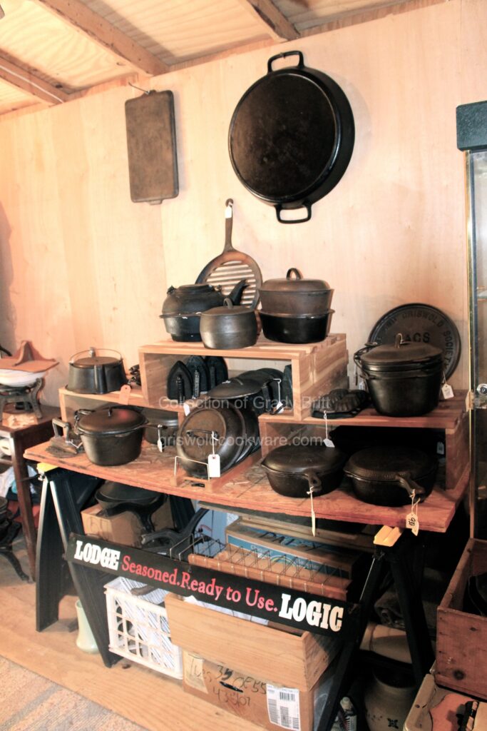 Pretty display in collector Grady Britt's shed showing unusual qnd hard to find vintage and antique cast iron cookware by Lodge and Griswold. 