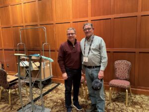 Banquet at the Erie PA Griswold and Cast Iron Cookware Association convention. Host Gary Baran receiving an award from Scott McCarter. 