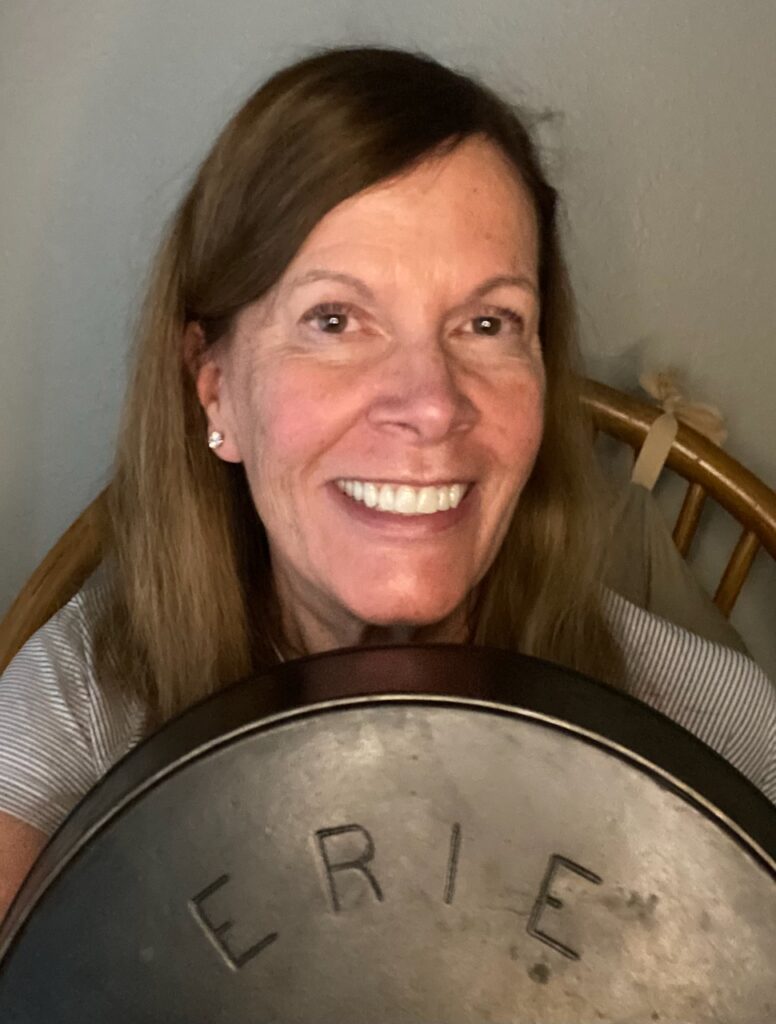 Mary holding cracked GriswolERIE number 11 skillet