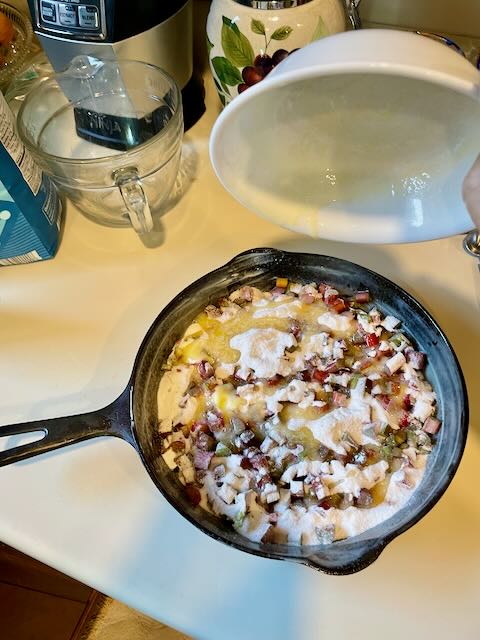 rhubarb cake preparation in cast iron skillet