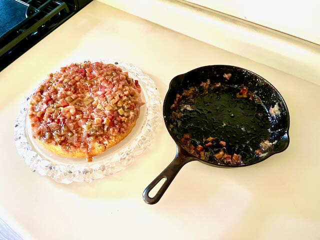 rhubarb upside down cake alongside vintag griswold cast iron pan