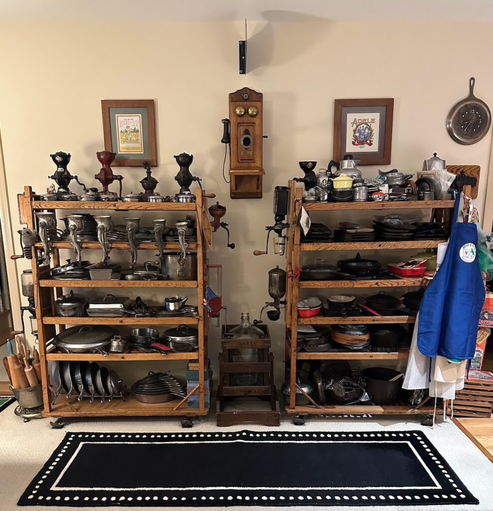 vintage and antique cast iron collection on antique rolling shoe racks. 